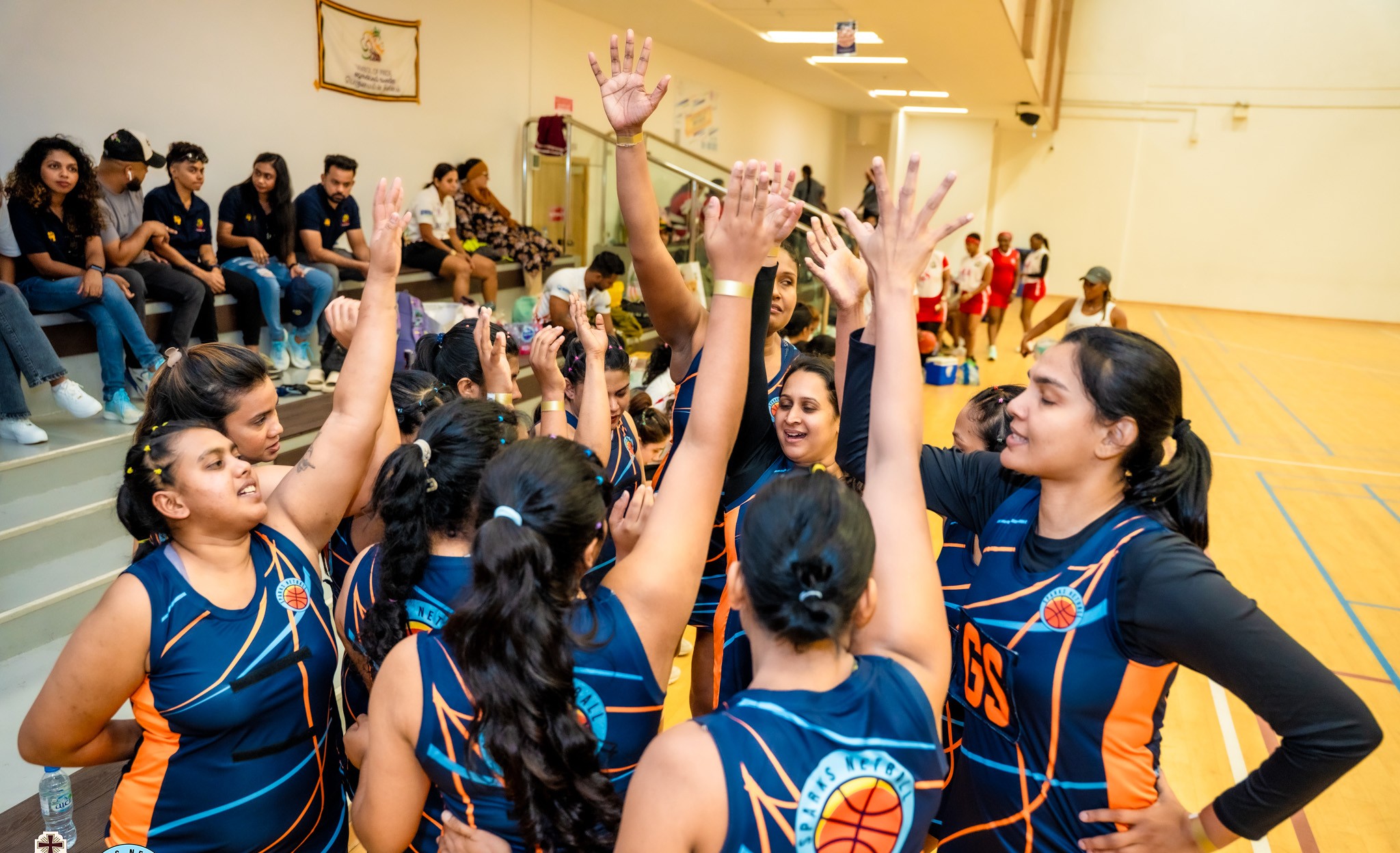 Team huddle celebrating together at last year's Legacy Netball Cup