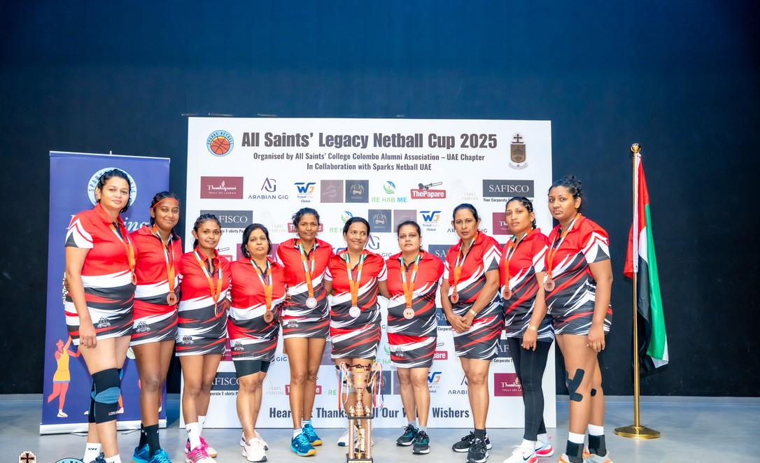 Team with medals and trophy at last year's Legacy Netball Cup